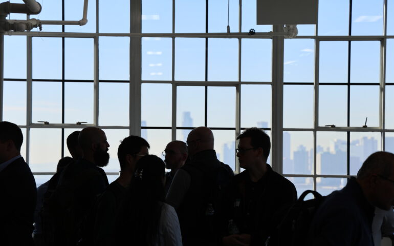 NetDevOps Day New York attendees mingle with a beautiful water view in the background